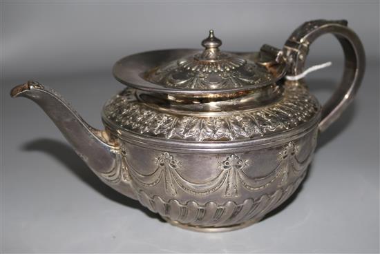 A late Victorian demi fluted silver teapot by Mappin & Webb, London 1891, gross 17.5 oz.